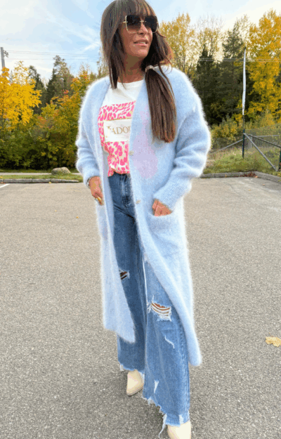 Namnlös design Ljusblå lång kofta i kid mohair med fickor och glittrande knappar från Love Forever