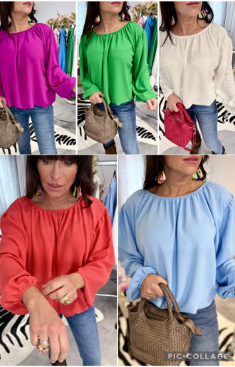 Blus med resår vid halsringning, nedtill och ärmslut, justerbar off-shoulder och ärmar, normal till rymlig passform på modell.