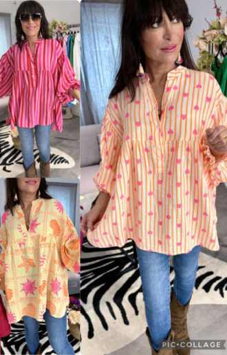 Oversize skjortblus i krinklad bomull med print, lång modell med resår vid ärmslut och luftig passform.