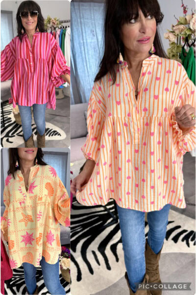 Oversize skjortblus i krinklad bomull med print, lång modell med resår vid ärmslut och luftig passform.