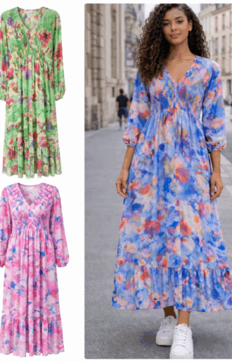 Bohemisk klänning i 100% viskos med smock över byst och rygg, v-ringad hals, långa ärmar och volang nedtill.