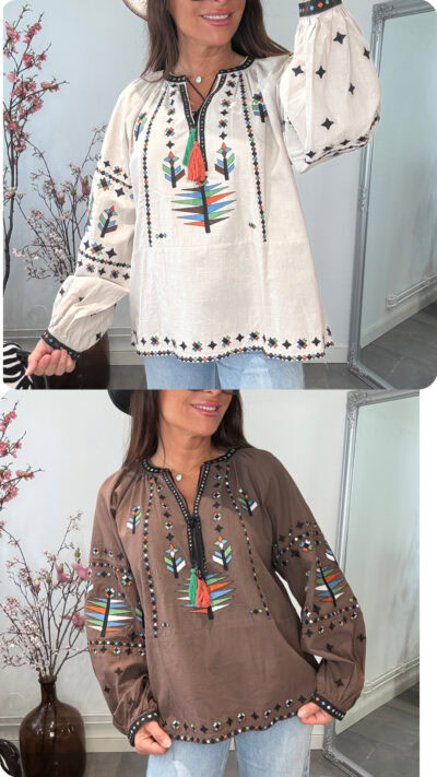 Bohemisk blus i 100% bomull med indianinspirerade broderier och knytning i halsen från Love Forever, finns i offwhite och chocolate.